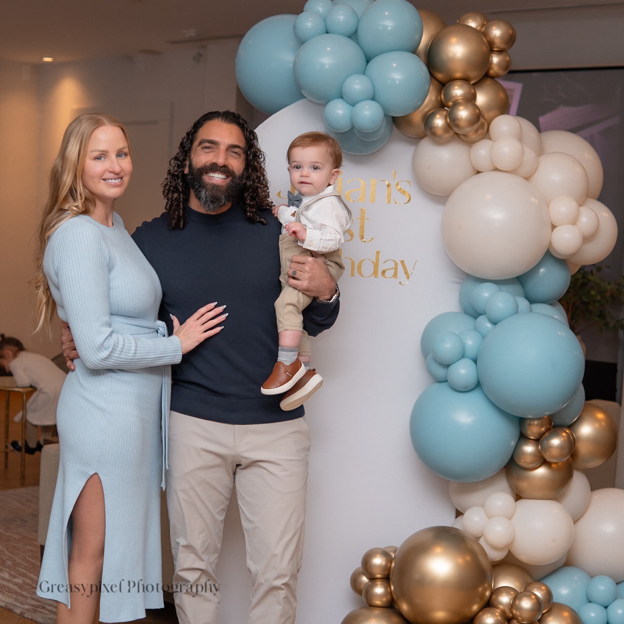 First birthday photography Waterloo - guests holding baby